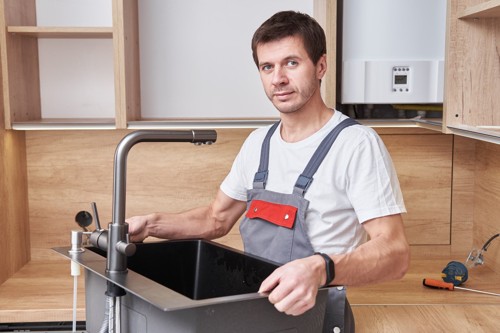 male-plumber-install-sink-in-the-kitchen.jpg